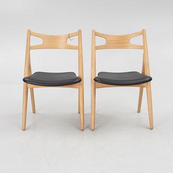 Hans J Wegner, a pair of chairs, model CH 29 "The Savbuk Chair", Carl Hansen.