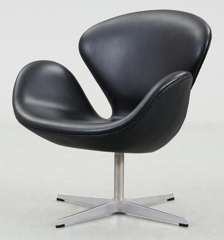 A Arne Jacobsen black leather "Swan" easy chair, Fritz Hansen, Denmark 2001.