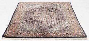 An oriental rug, approx. 203 x 135 cm.