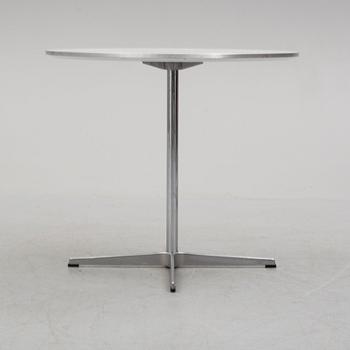 A 'Supercirkel' table by Bruno Mathsson & Piet Hein, Denmark, 1978.