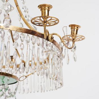 A German Louis XVI ormolu and cut-glass nine-light chandelier attributed to Johann Christoph Ermisch, late 18th century.