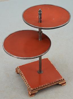 An Axel-Einar Hjorth red lacquer table 'Åbo' on a silver plated brass leg, Nordiska Kompaniet (NK) 1929-30.