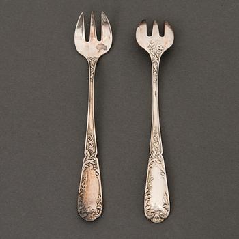 A set of 12 silver plated oyster forks from the early 20th Century.