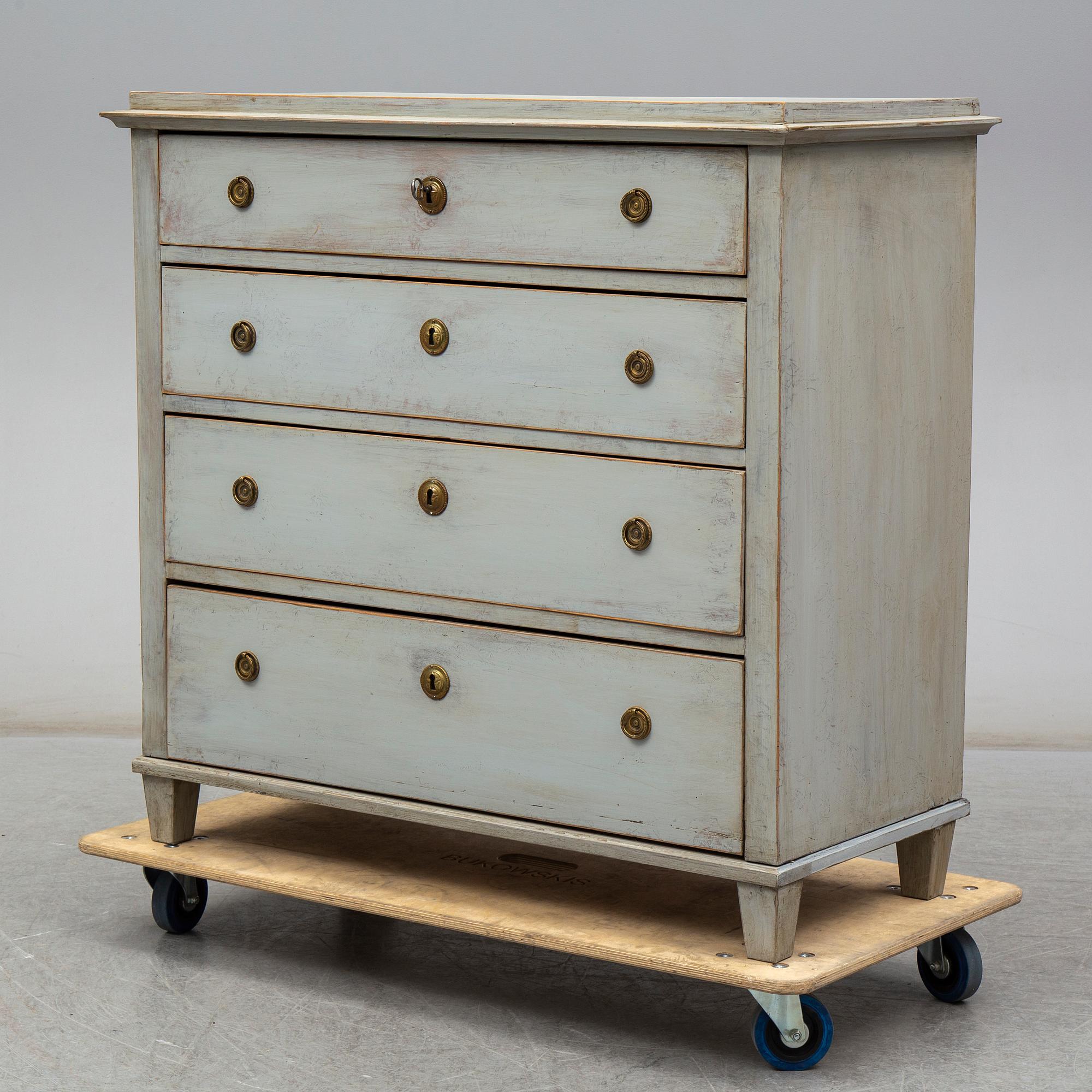 a chest of drawers from the first half of the 19th century.