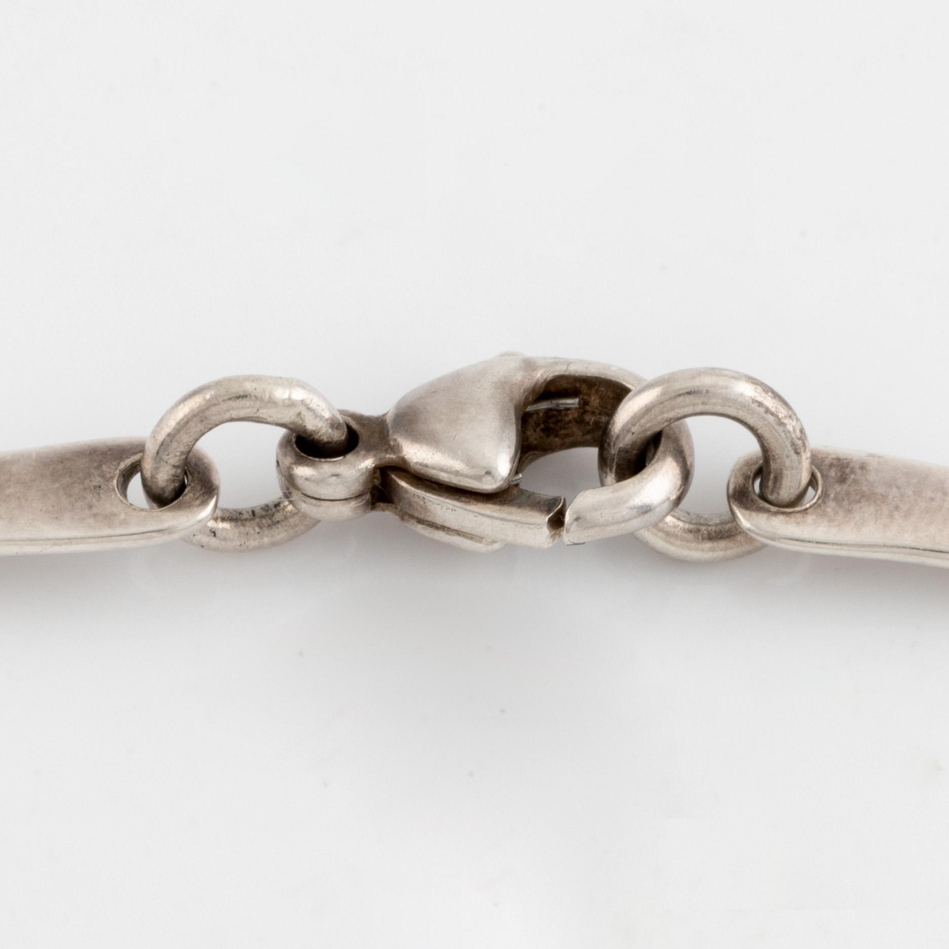 Annie Jägbeck silver necklace and earrings.