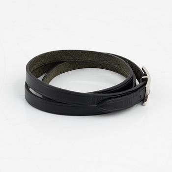 Hermès, a black leather 'Behapi' bracelet.