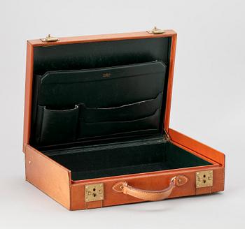 A 1990s naturel cowhide leather brief cse by Louis Vuitton.