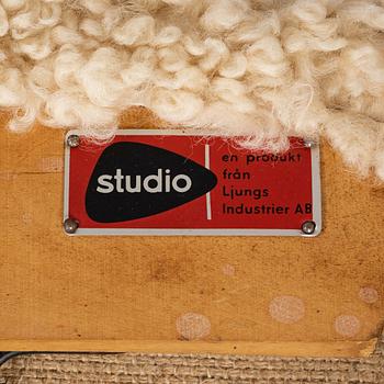 Alf Svensson, a 'TeVe' easy chair, with new sheepskin upholstery. Bra Bohag, Studio Ljungs Industrier, 1950's.