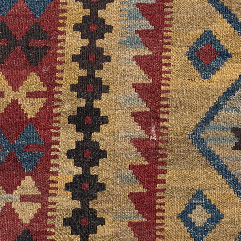 A Kelim rug, c. 250 x 142 cm.