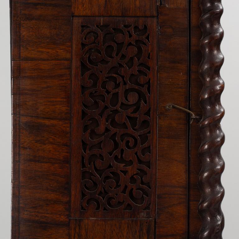 A late Baroque longcase clock, England, early 18th century.