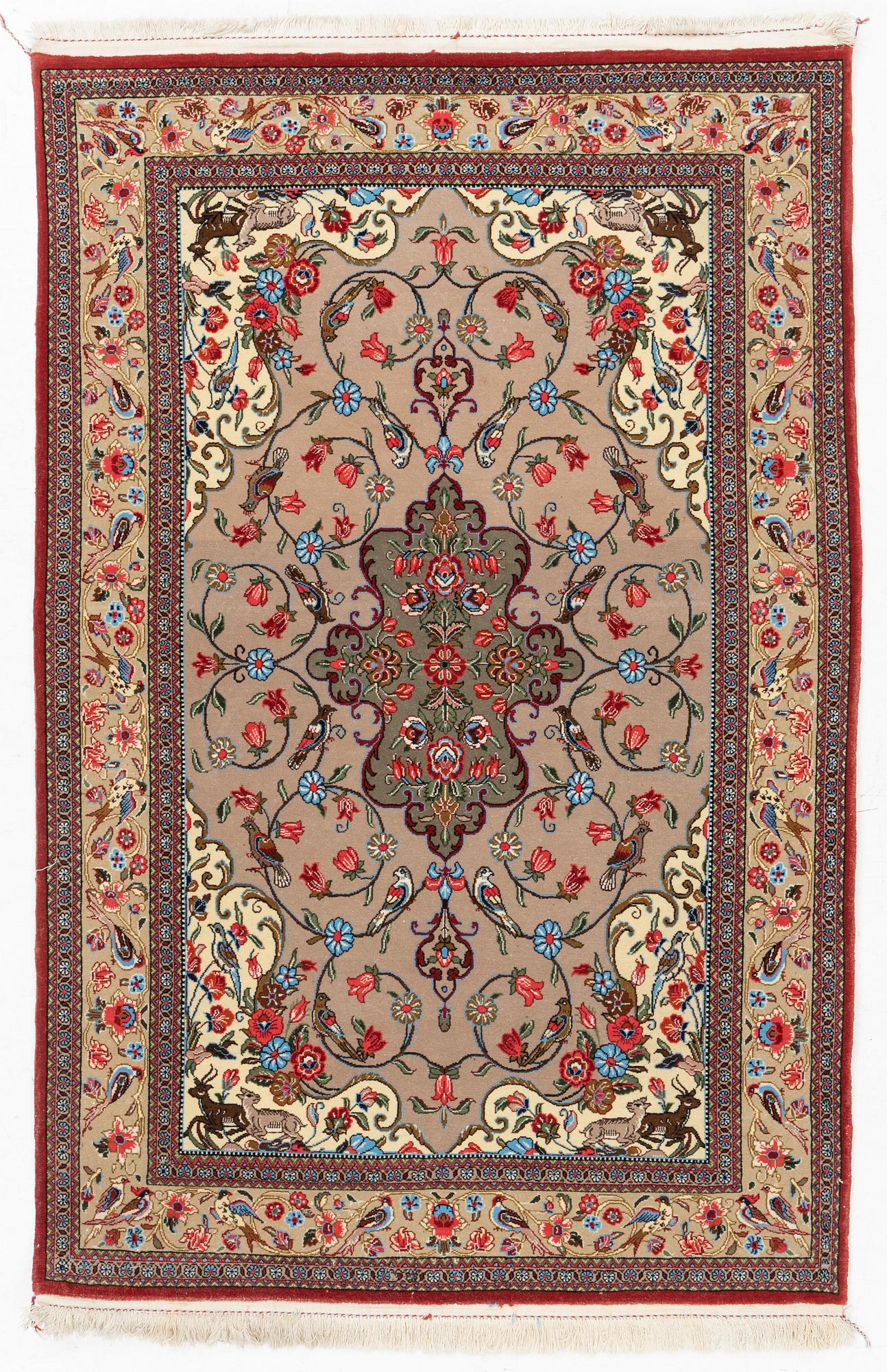 A Ghom rug, c. 160 x 105 cm.