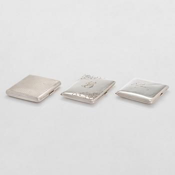 Three sterling silver cigarette cases, including EL Weimann and Nussbaum & Hunold.