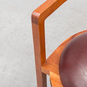 FRANK LLOYD WRIGHT, A cherry wood 'Barrel chair' from Cassina, late 20th century.