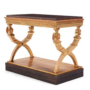 51. An Empire giltwood and 'Blyberg' porphyry console in the manner of J. Frisk, Stockholm early 19th century.