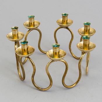 A Lars Holmström brass candle holder for seven candles, Svenskt Tenn, second half of the 20th century.
