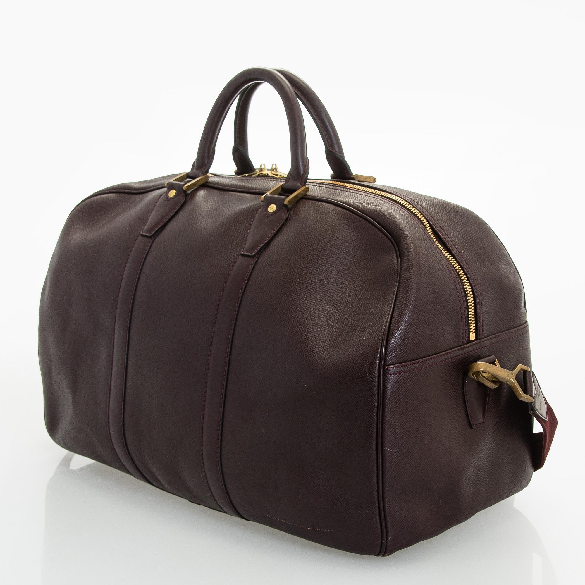Louis Vuitton, a 'Taiga Kendall PM' weekend bag.
