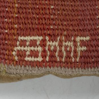 Märta Måås-Fjetterström, a cushion, 'Blommor på röd botten', signed AB MMF, ca. 31 x 31 cm.