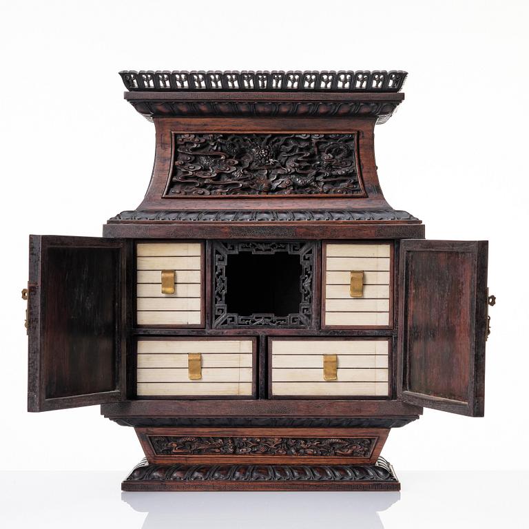 A hardwood dragon cabinet, Qing dynasty 18/19th Century.