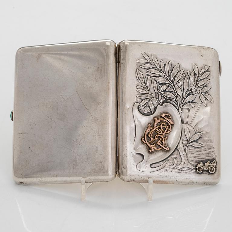 A silver cigarette case, Moscow, dated 1916.