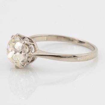 An 18K white gold ring set with a cushion formed old-cut diamond weight ca 2.75 cts quality ca L/M i.