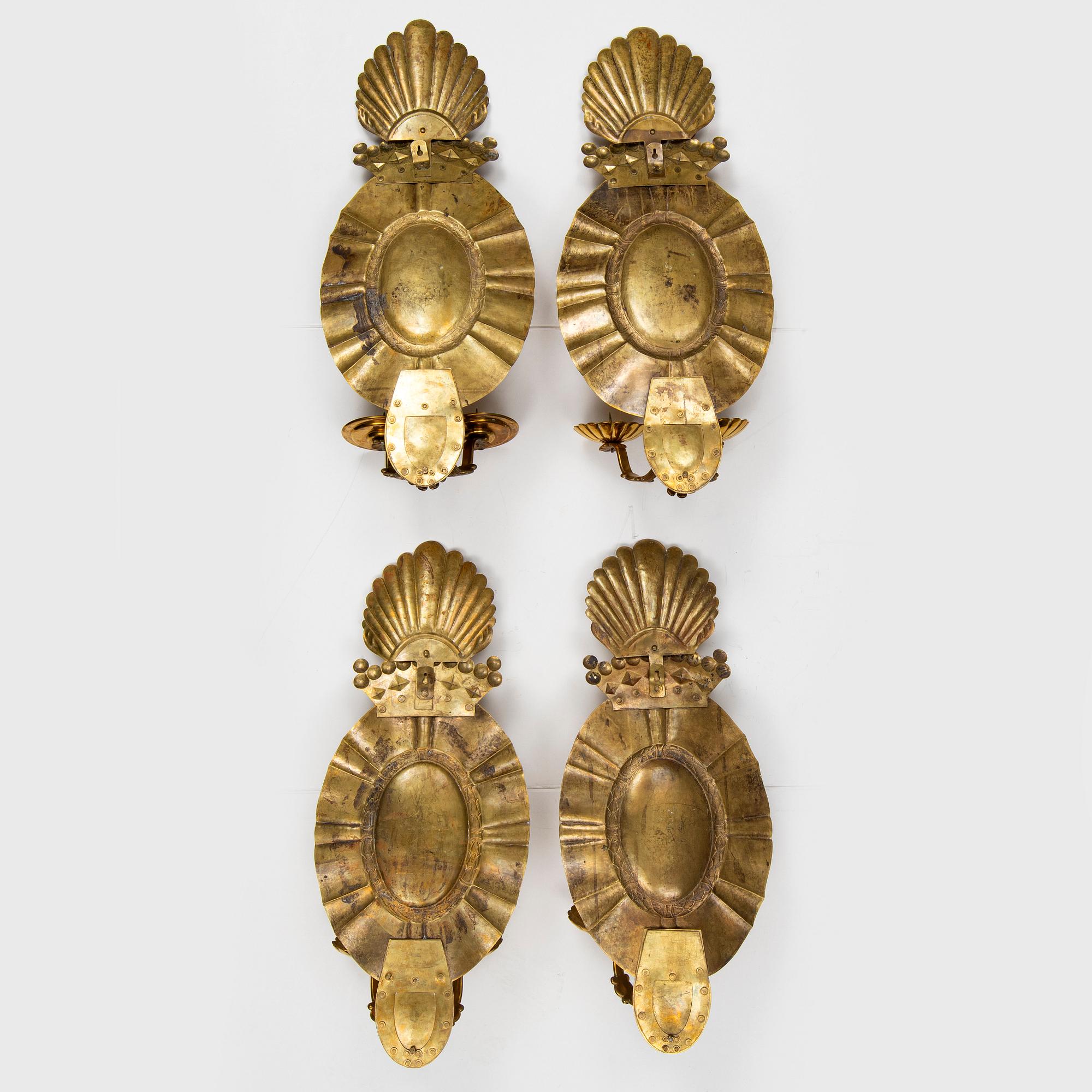 A set of four baroque style brass wall sconces, probably 1950s.