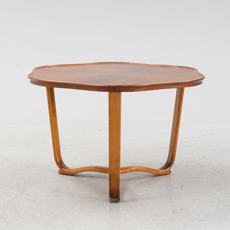 A 1940s mahogany coffee table.