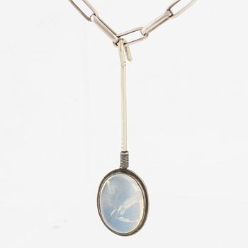 Pendant with silver chain and blue stone, likely moonstone.