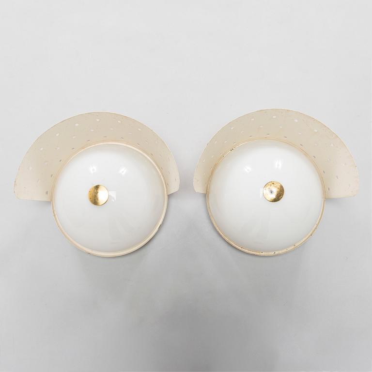 Paavo Tynell, a pair of mid-20th-century '2050' wall/ outdoor lights for Taito, Finland.