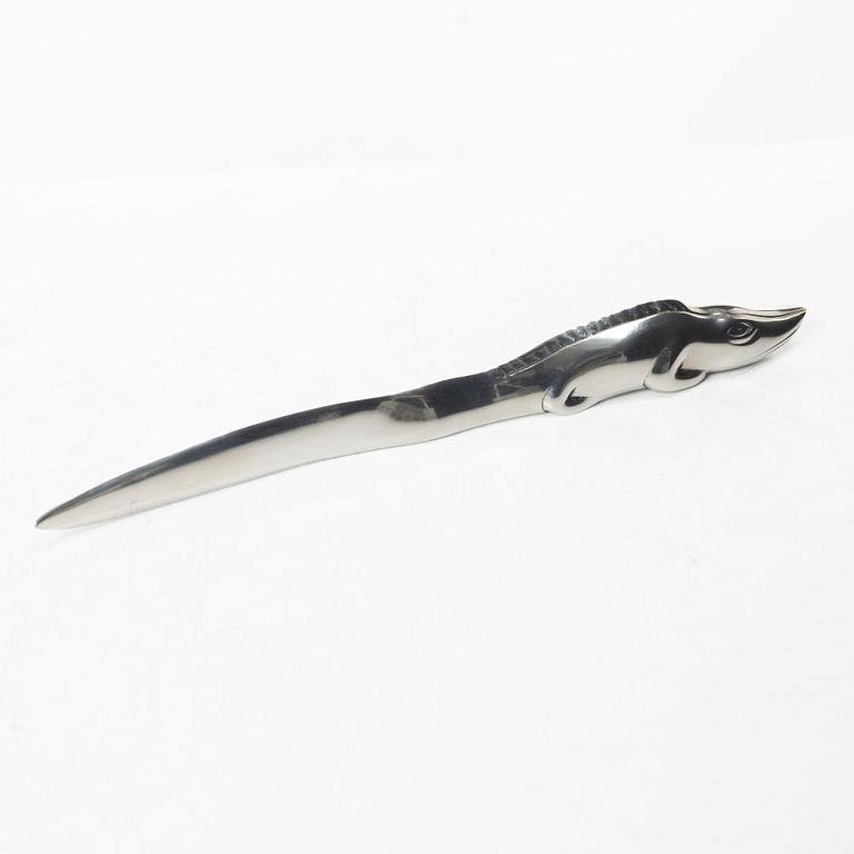 Firma Svenskt Tenn, Candelabrum, 'Vänskapsknuten', and paper knife, 'Alligator'.