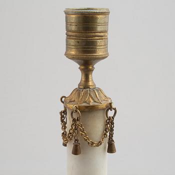 A late Gustavian gilt brass and marble candlestick, late 18th century.