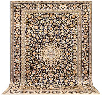A Kashan carpet, a. 405 x 290 cm.