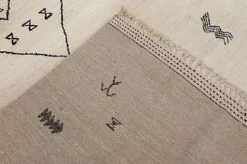 A Moroccan design carpet, c. 306 x 201 cm.