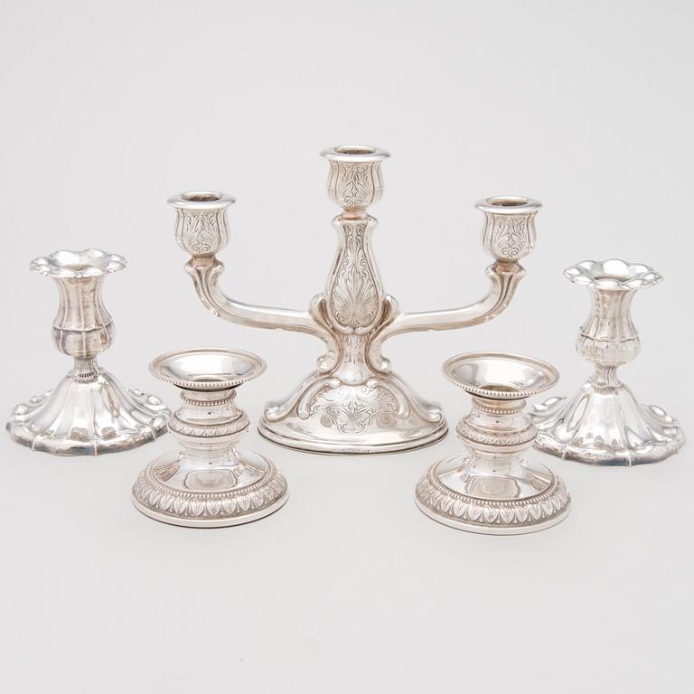 A candelabrum and two pair of candlesticks in silver, Hämeenlinna and Turku, Finland 1950s-1960s.