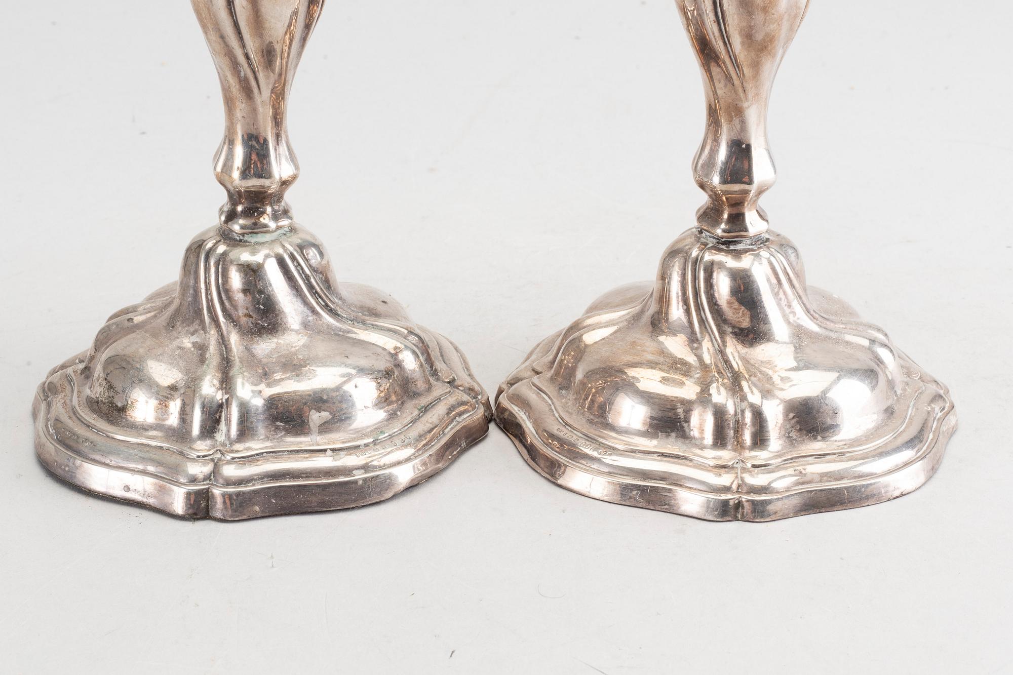 A 20th century pair of silver candle sticks rococo-style, height ca 22 cm.