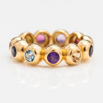 An 18K gold ring with different gemstones. Ofelia Jewelry, Helsinki.