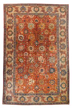 A carpet, a semi-antique Tabriz, ca 528-535 x 346,5-352,5 cm, signed Farhan.