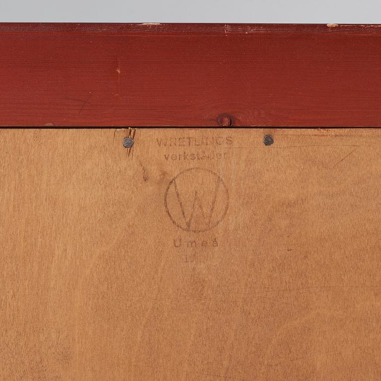 A red lacquered cabinet with carved and bronzed decoration 'à la chinoise', by Otto Wretling, Umeå, Sweden 1930's.