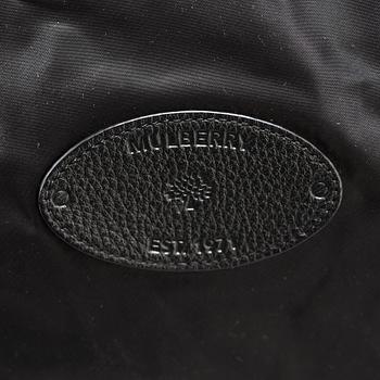 A foldable Mulberry weekend bag.