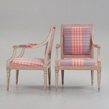 Two matched Gustavian armchairs, by Jakob Malmsten (master in Stockholm 1780-88).