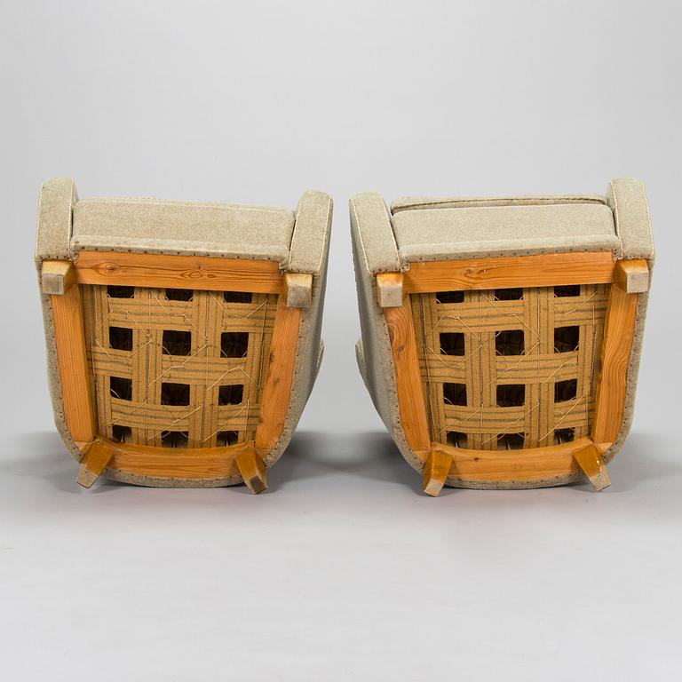 A pair of mid-20th century armchairs.