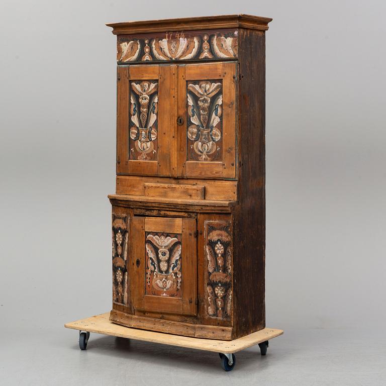 A traditional painted swedish cabinet dated 1744.