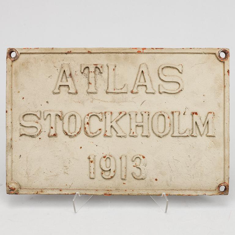 An iron sign,  "Atlas Stockholm 1913".