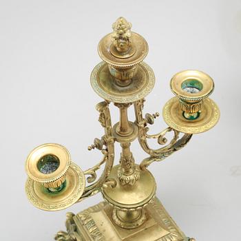 A table clock and two candelabras, around the year 1900.