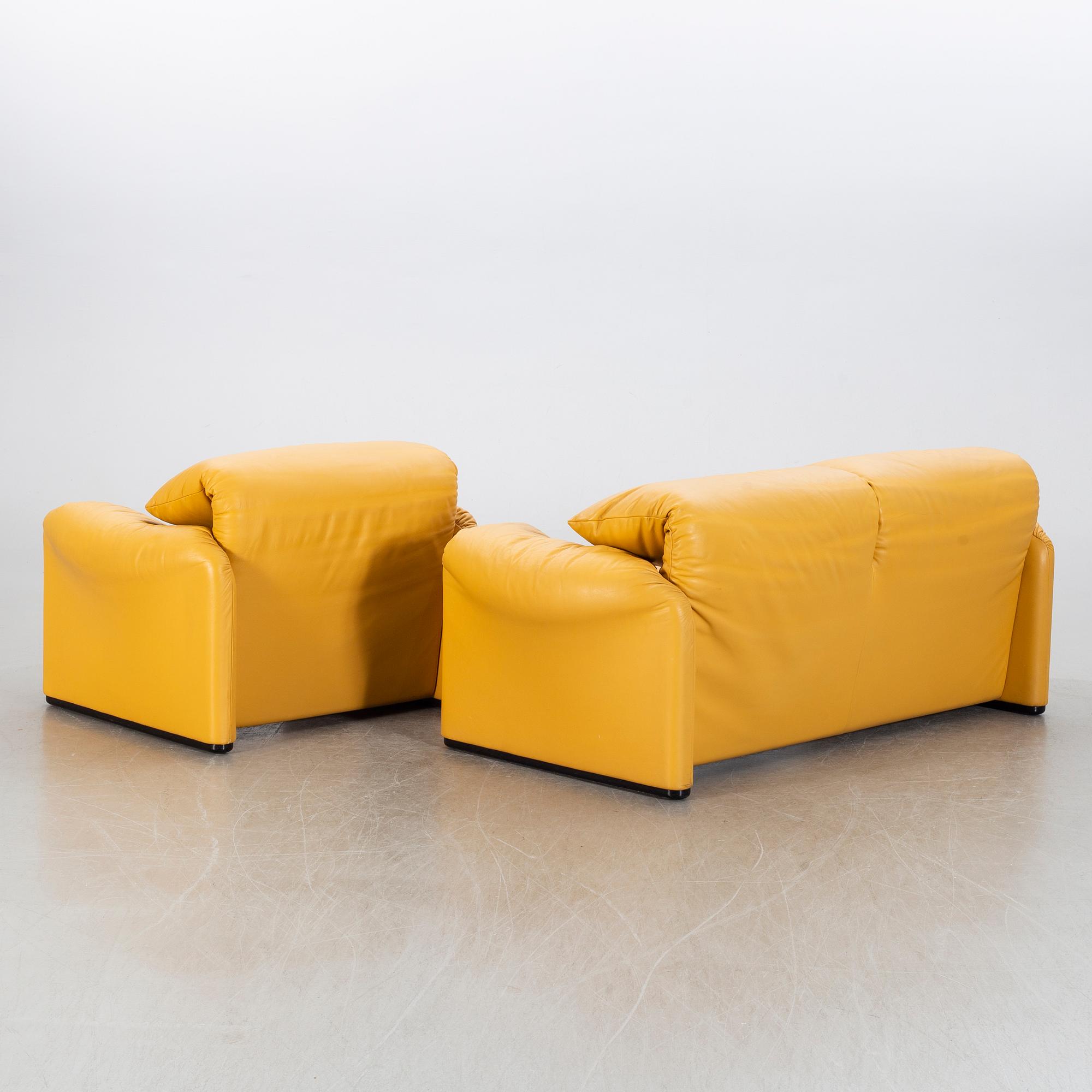 A "Maralunga" leather sofa and easy chair by Vico Magistretti, Italy.