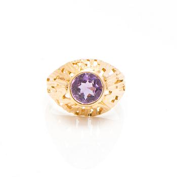 A set of 14K gold earrings and a ring with amethysts.