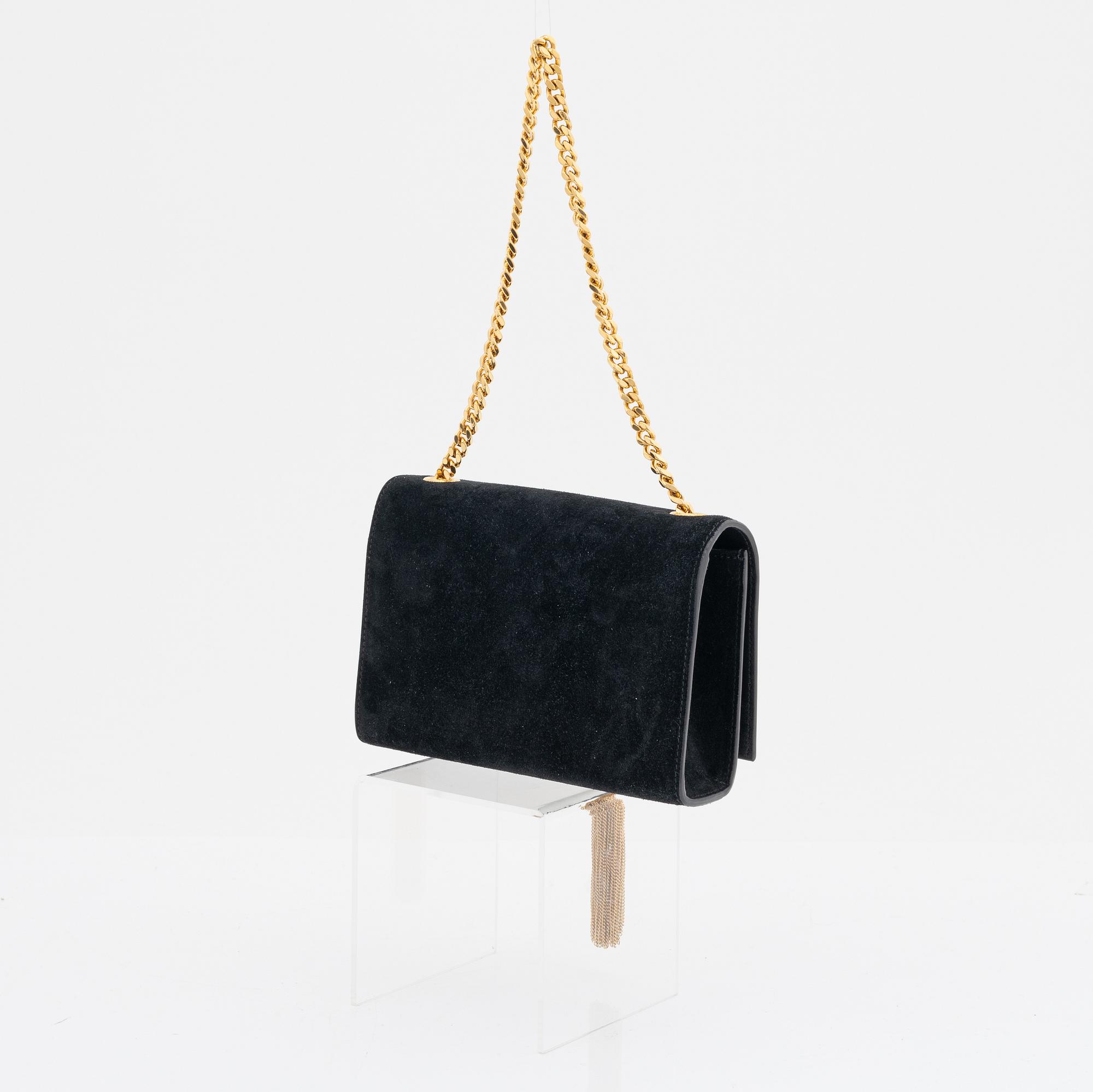 Yves Saint Laurent, a black suede 'Kate Small' handbag.