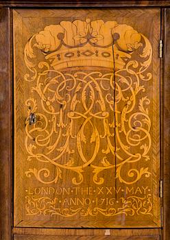An English early 18th century walnut veneered and gilt bronze Bureau-Cabinet decorated with marquetry in première and contre partie on both sides of a cabinet door "LONDON THE XXV MAY ANNO 1716" under monogram SGB and Marquess's coronet.