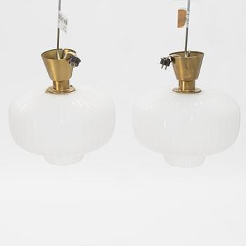 A pair of glass and brass Swedish Modern ceiling lights, Böhlmarks, 1940's.