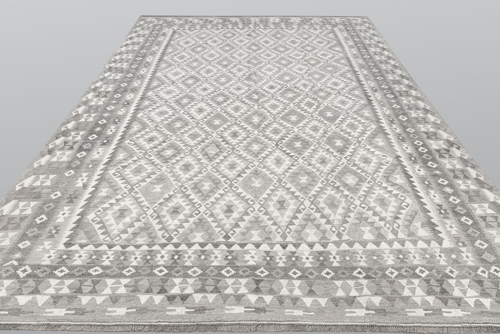A carpet, kilim, ca 390 x 298 cm.