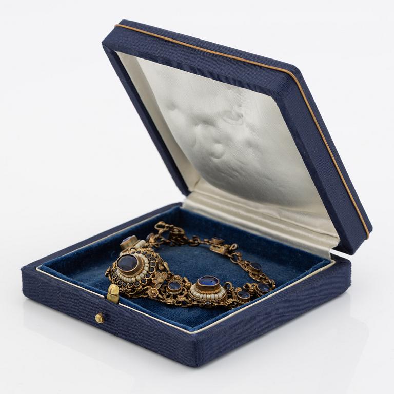 Bracelet, gilded silver with synthetic blue stones.